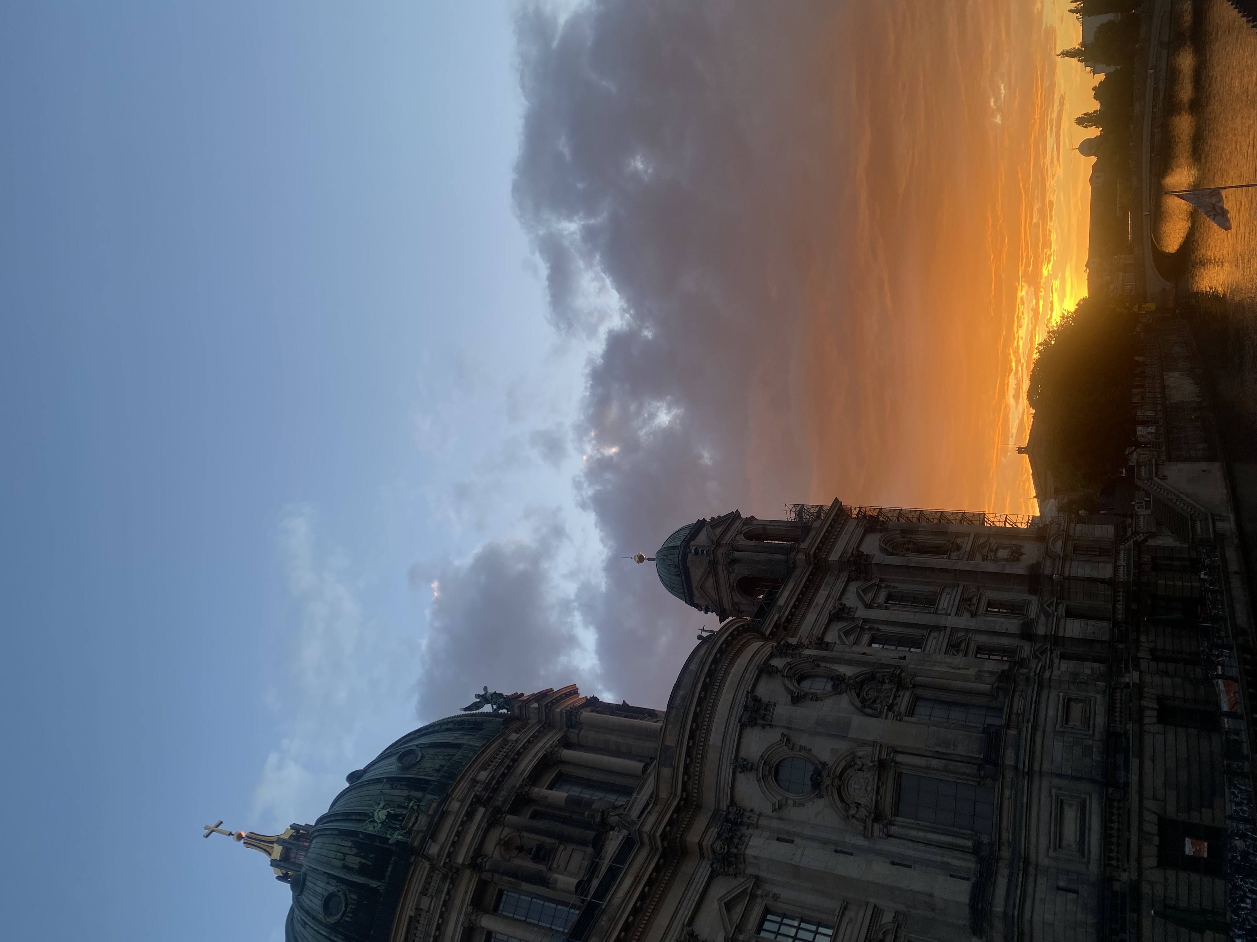 The Berliner Dom at sunset from Rathausbrücke, verdigris dome backlit by amber sky