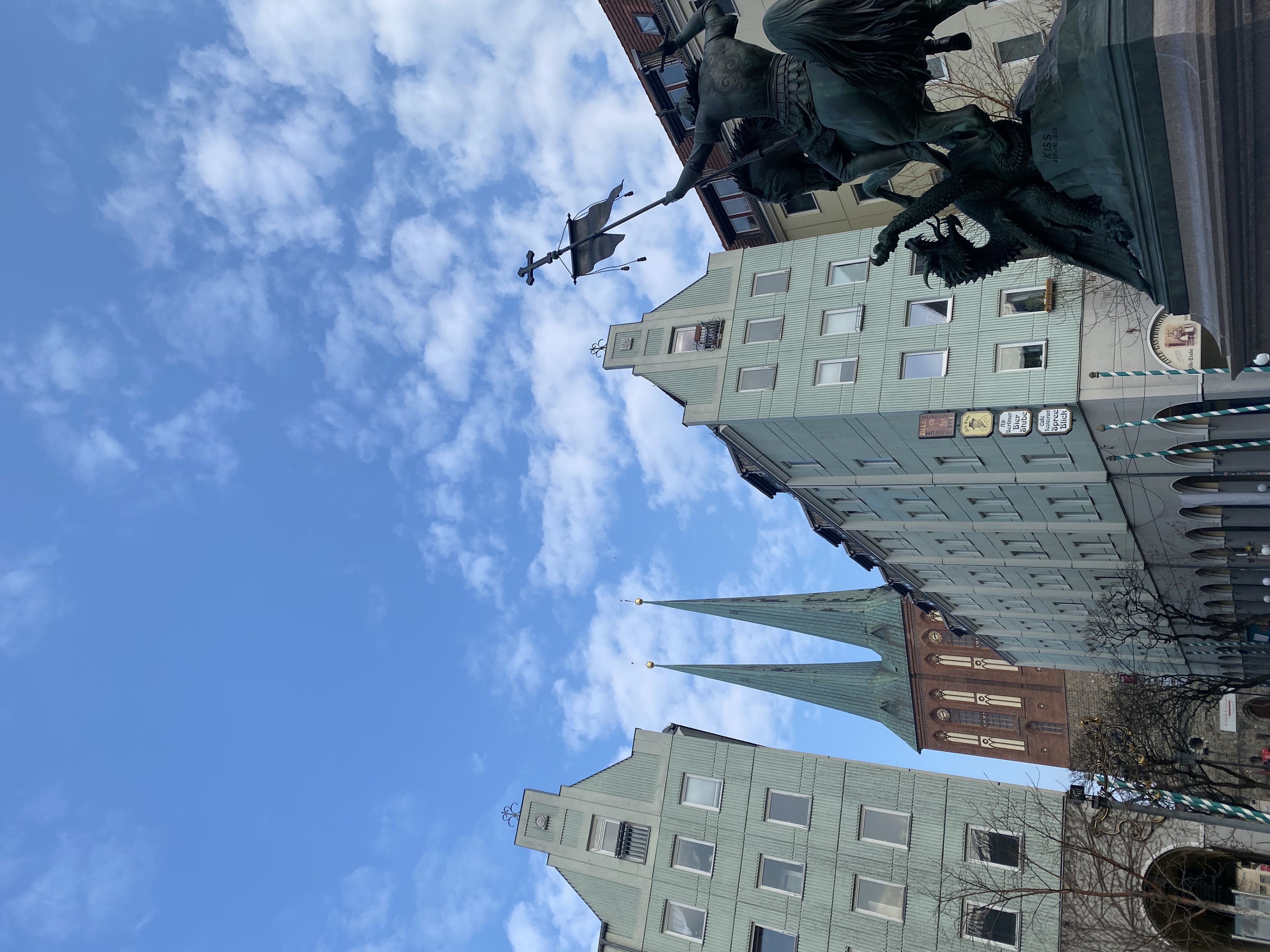 Nikolaiviertel: equestrian sculpture by August Kiss in the foreground, twin spires of the Nikolaikirche beyond